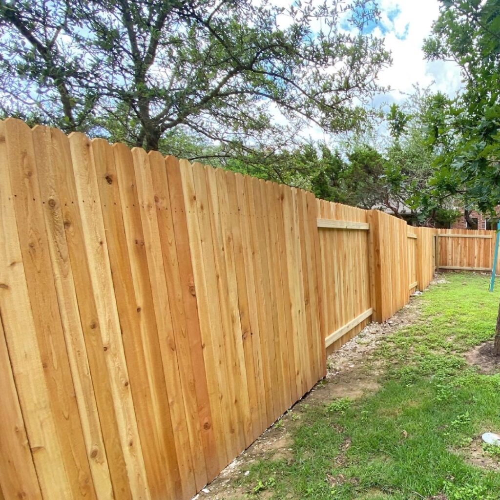Sleek vertical picket fence offering both boundary definition and decorative flair.