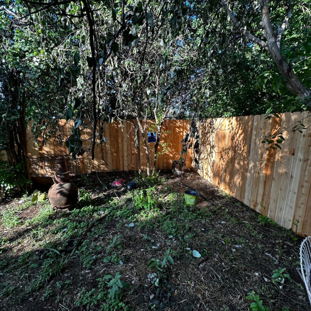 Wooden vertical picket fence installation designed for long-lasting performance and visual appeal.