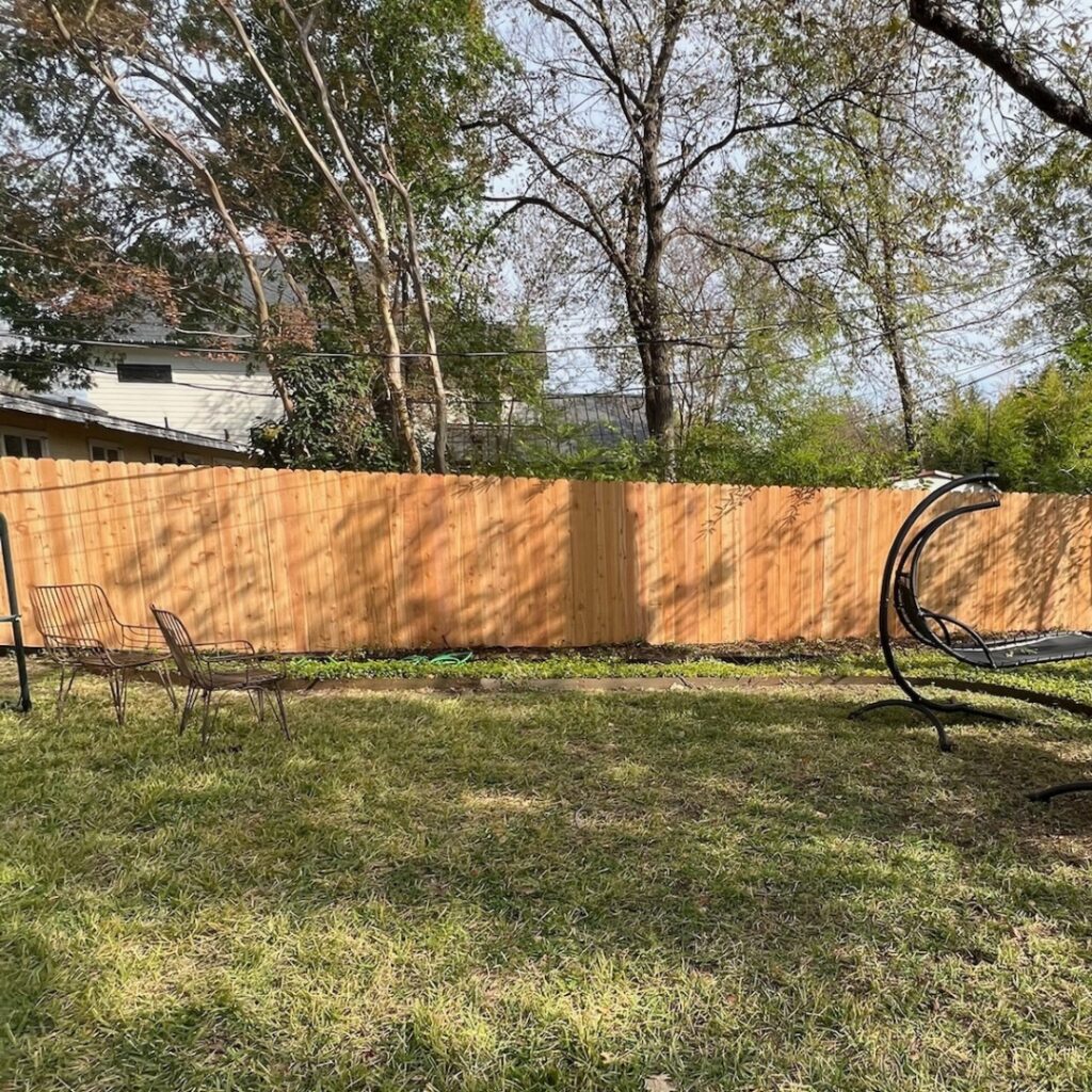 White vertical picket fence in Austin, Texas, adding a classic touch to the landscape.