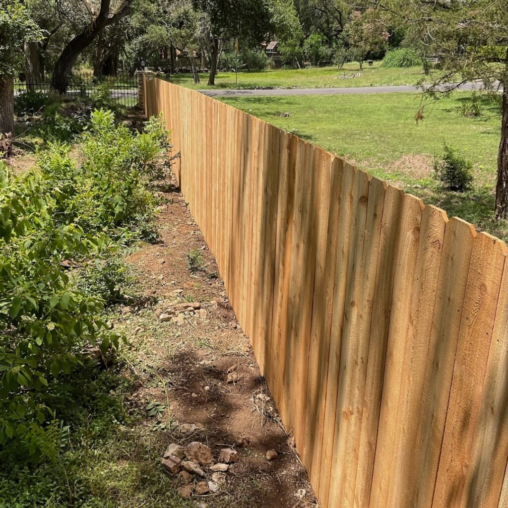 Well-crafted vertical picket fence enhancing the curb appeal of a Texas property.