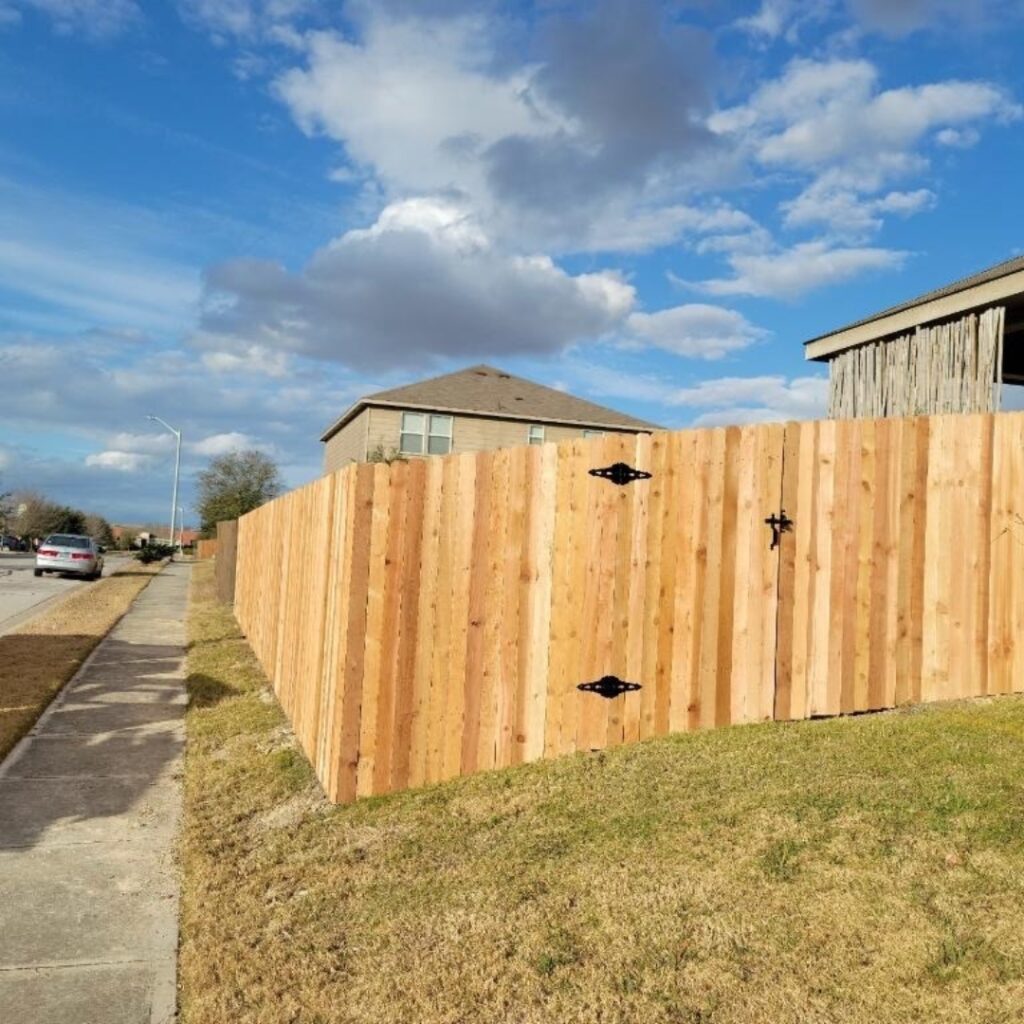 Modern vertical picket fence built in Austin, Texas, offering privacy with a timeless look.
