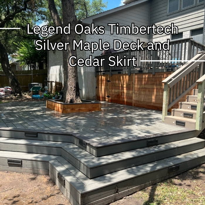 A tree sits on a Timbertech Silver Maple deck, accented by a Western Red Cedar skirt and illuminated by landscape lighting.