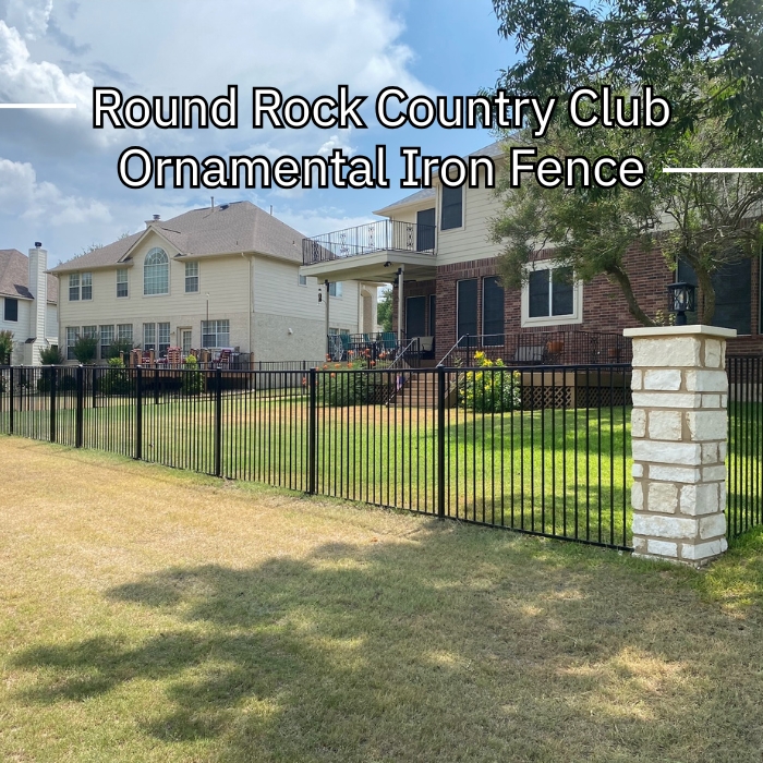 Decorative iron fence at Round Rock Country Club, featuring elegant patterns that enhance the landscape's beauty.