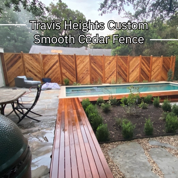 Custom smooth cedar fence at Travis Heights, showcasing natural wood grain and a polished finish in a residential setting.