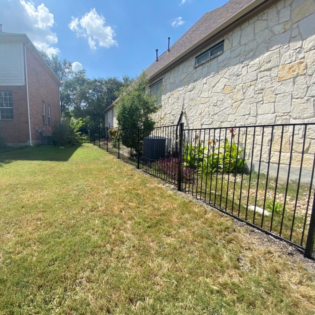 Austin TX home with ornamental metal fencing