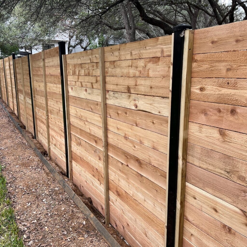 Sleek horizontal picket fencing providing structure and curb appeal to a Texas home.