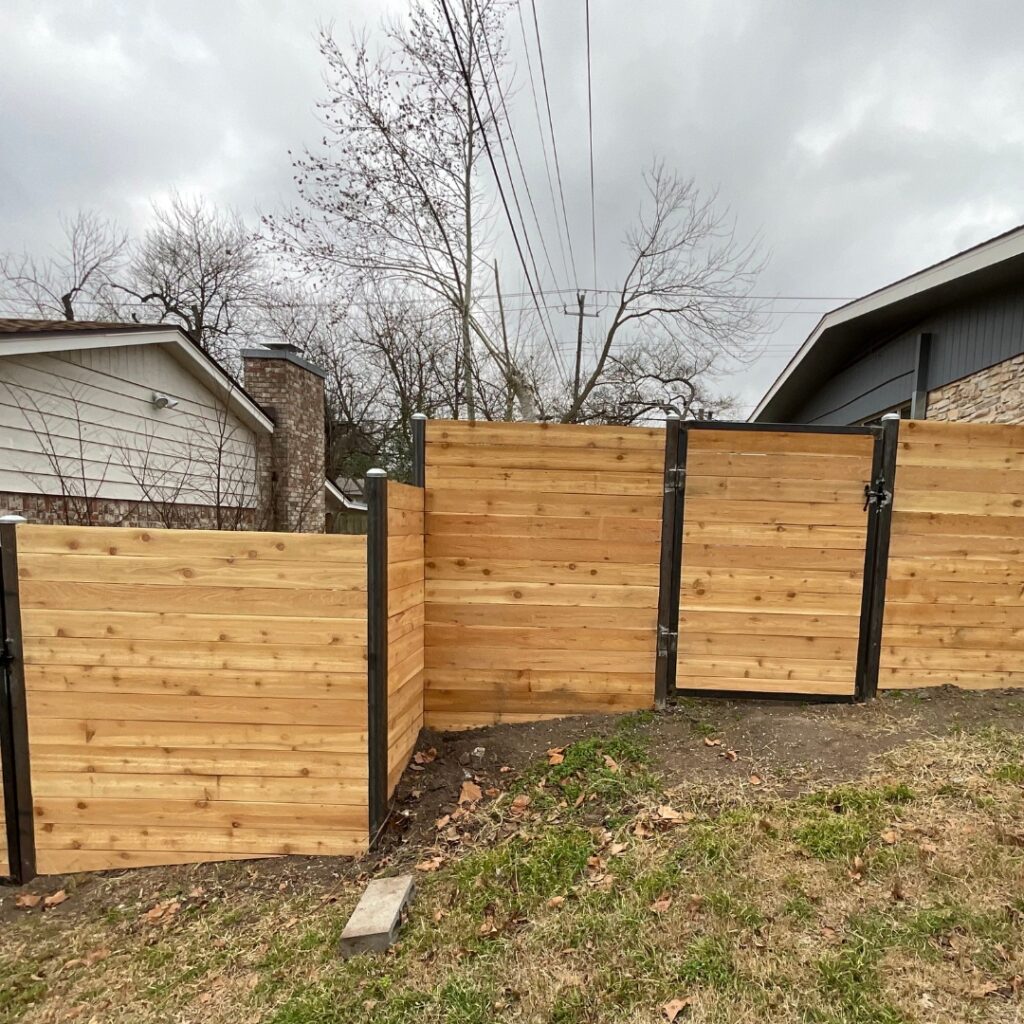 Backyard horizontal wood fence offering both beauty and practical function.