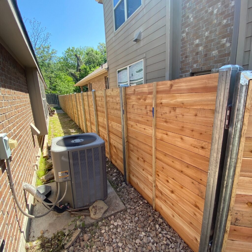Horizontal fence panels installed with precision for a stylish outdoor boundary.