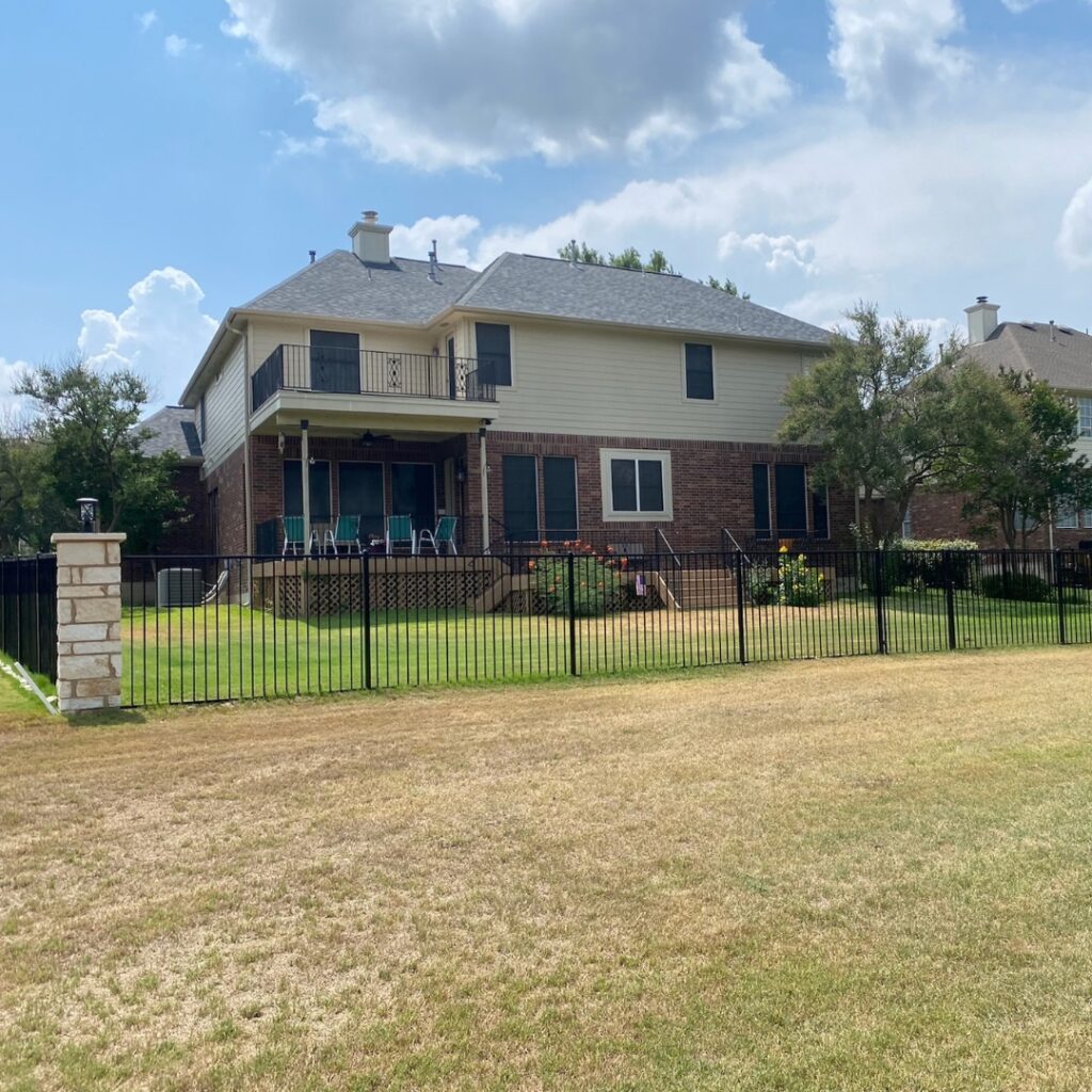 Custom-built ornamental fence with intricate metalwork tailored to fit Austin architecture.