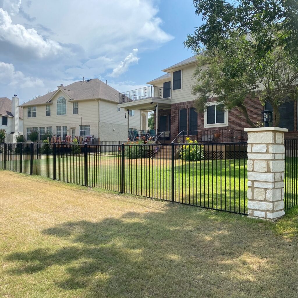 Decorative metal fence installed in Austin home