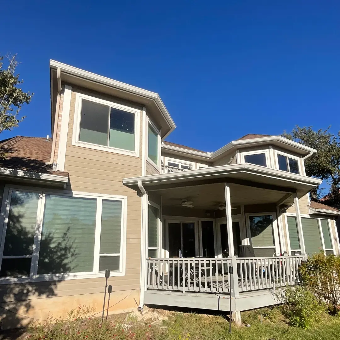Worn concrete pad and outdated siding before renovation began