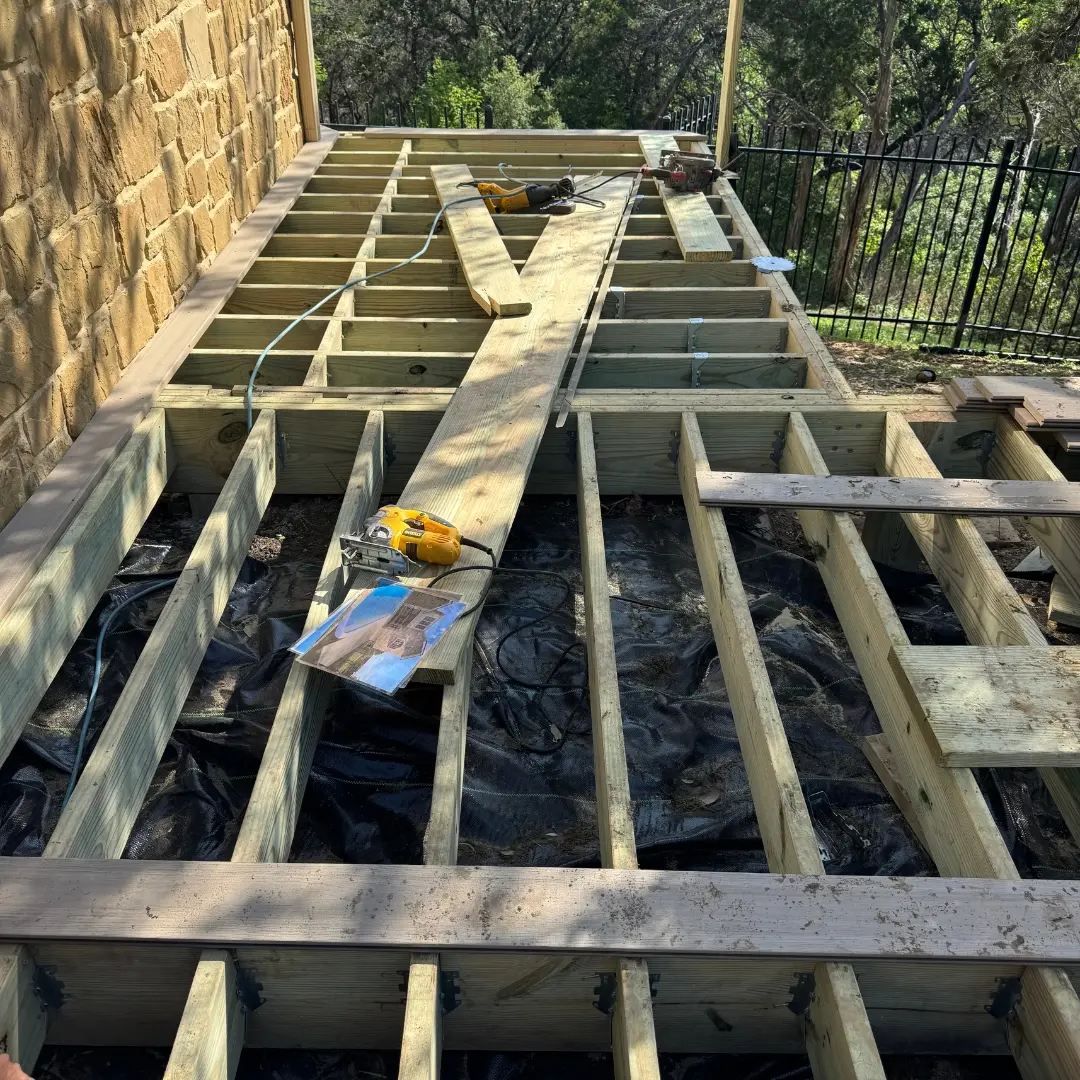 Framing underway for French White Oak PVC deck with pressure-treated lumber