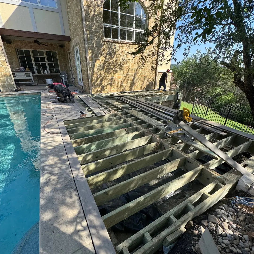 Framing underway for French White Oak PVC deck with pressure-treated lumber