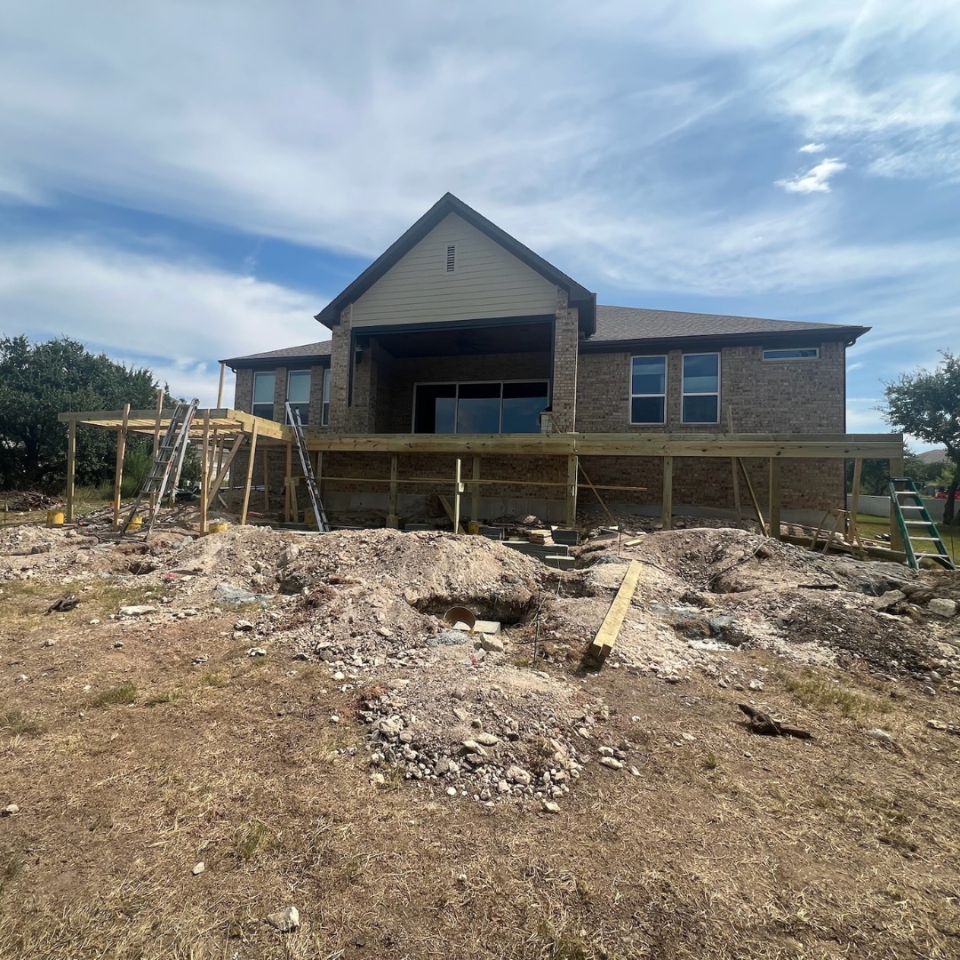 Workers installing Trex composite boards and preparing stainless steel cable railing system