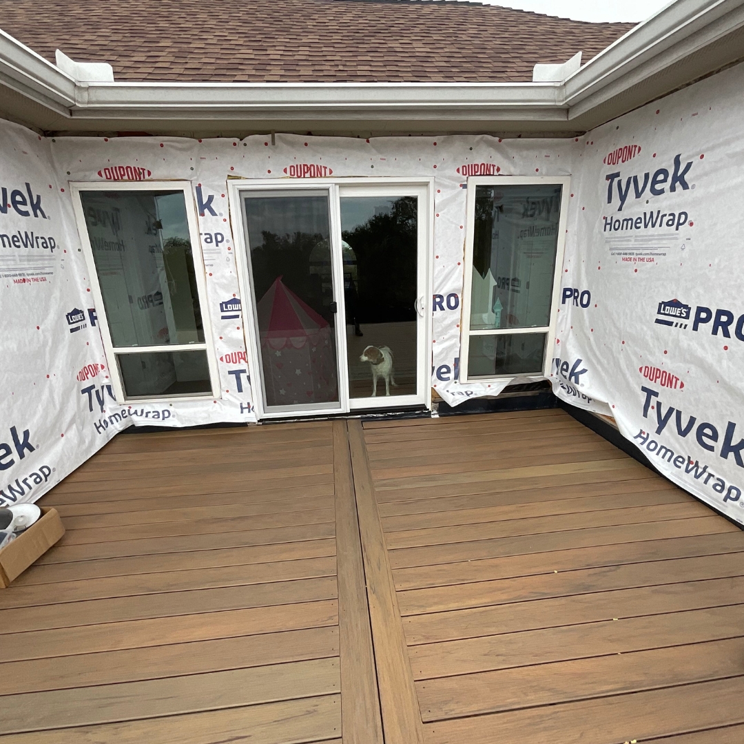 Deck boards partially installed with visible gaps for spacing and alignment