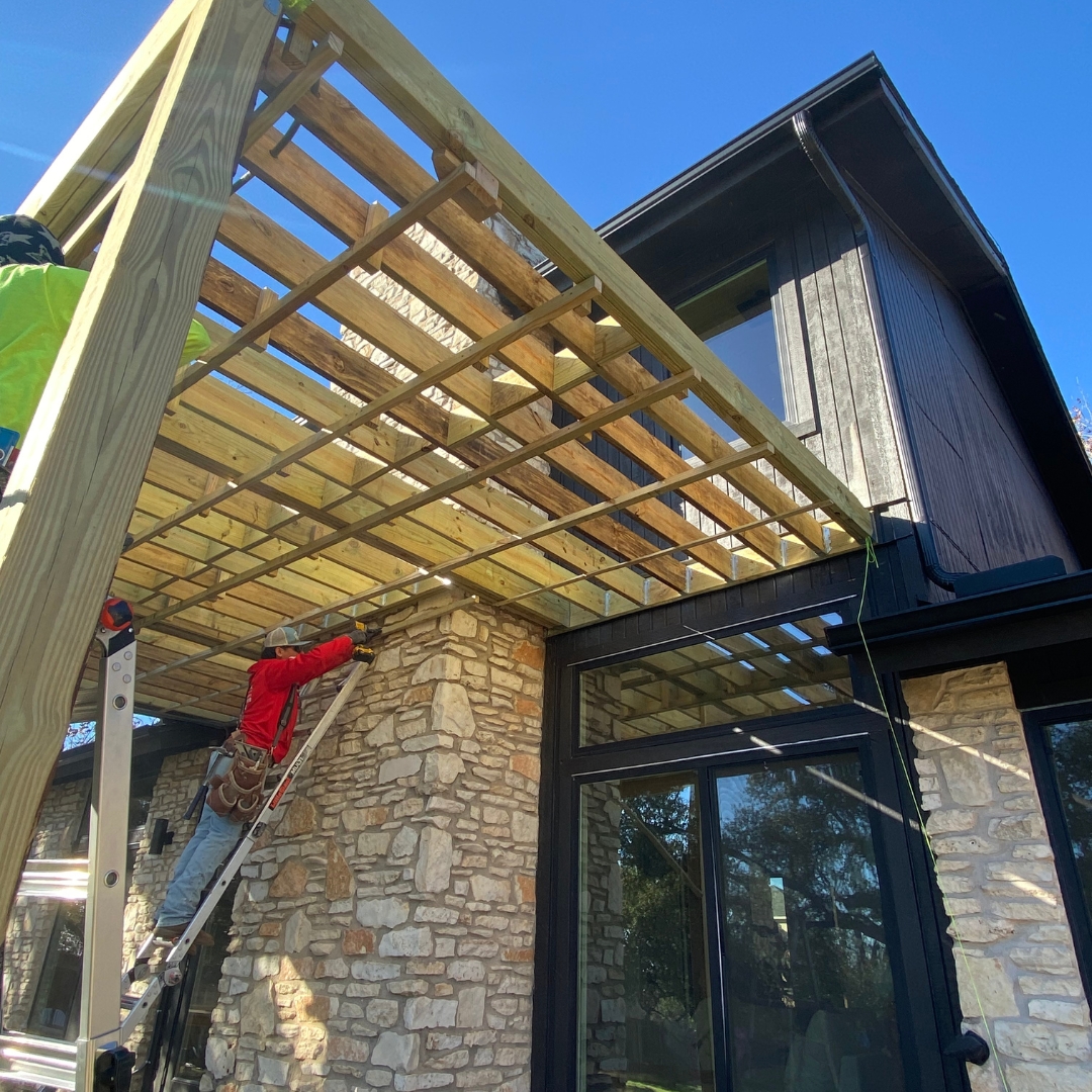 "Construction in progress for TimberTech French White Oak deck with framing and railing installation underway