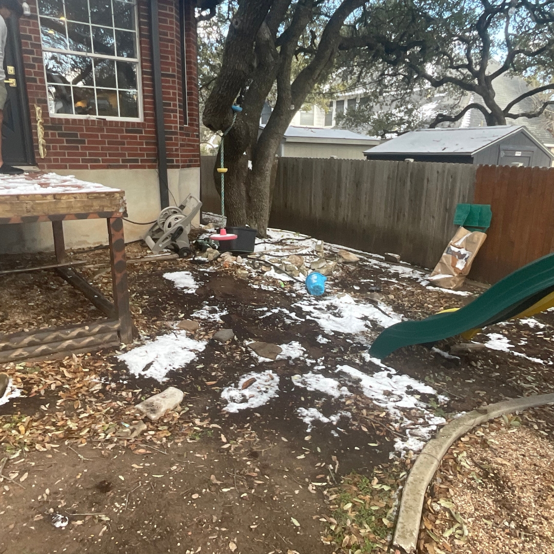 Existing outdoor space prior to IPE deck, steel railing, and cedar fence installation.
