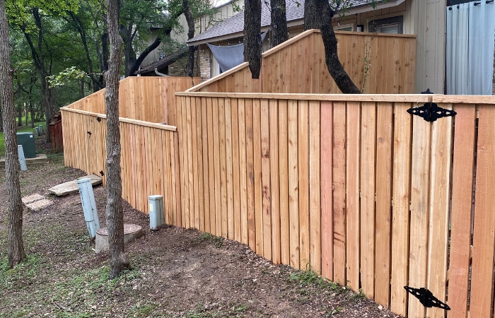 Completed Western Red Cedar shadowbox fence with matching gate and 4x4 pressure-treated posts.