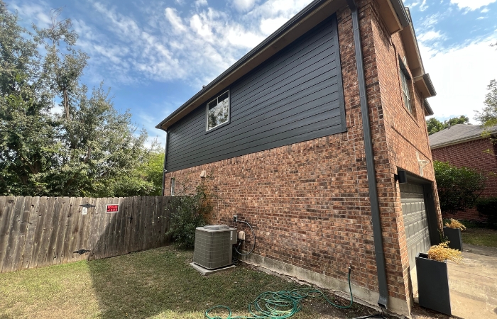 New Hardie Lap Siding fully installed and painted.