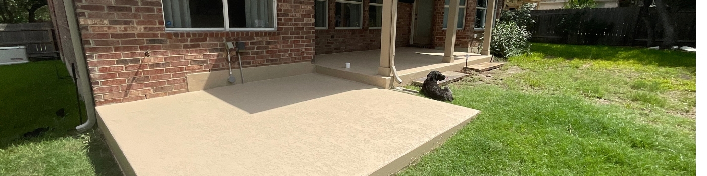 Smooth, stained concrete surface complementing new post finish.