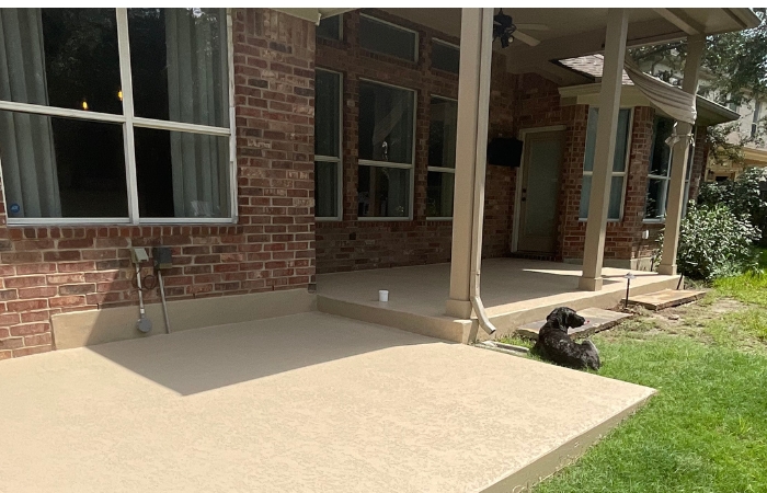 Smooth, stained concrete surface complementing new post finish.