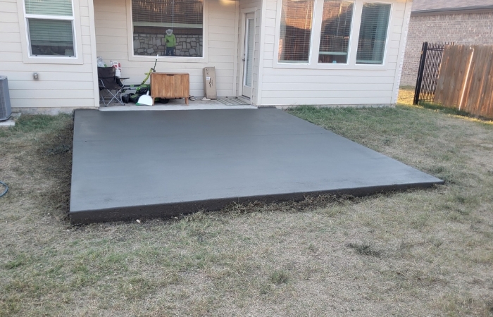 Finished 4-inch concrete slab with clean, smooth surface
