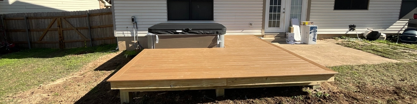 Close-up of Trex Beach Dune deck boards surrounding hot tub edge