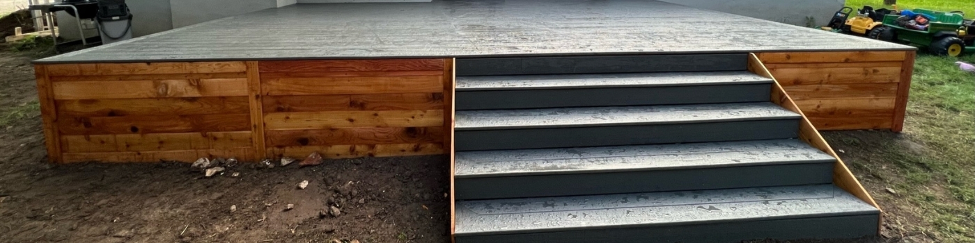 Finished Trex Clamshell deck with fully skirted Western Red Cedar finish