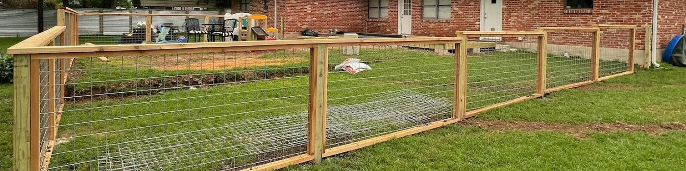 Completed bull panel railing with pressure-treated pine posts.