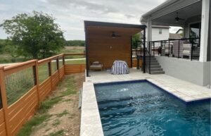 Finished steel patio cover with Tricorn Black finish and pine tongue-and-groove ceiling.